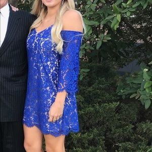 Blue off the shoulder dress.